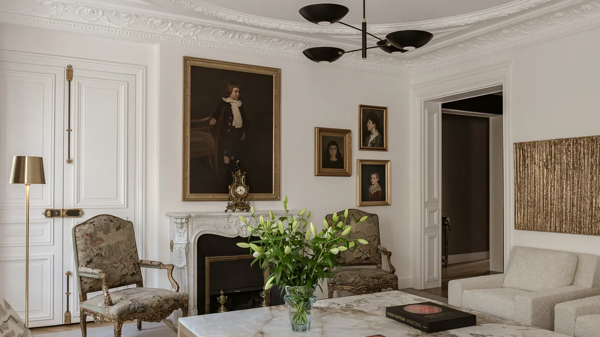 Haussmann apartment interior - antique portraits and period clock